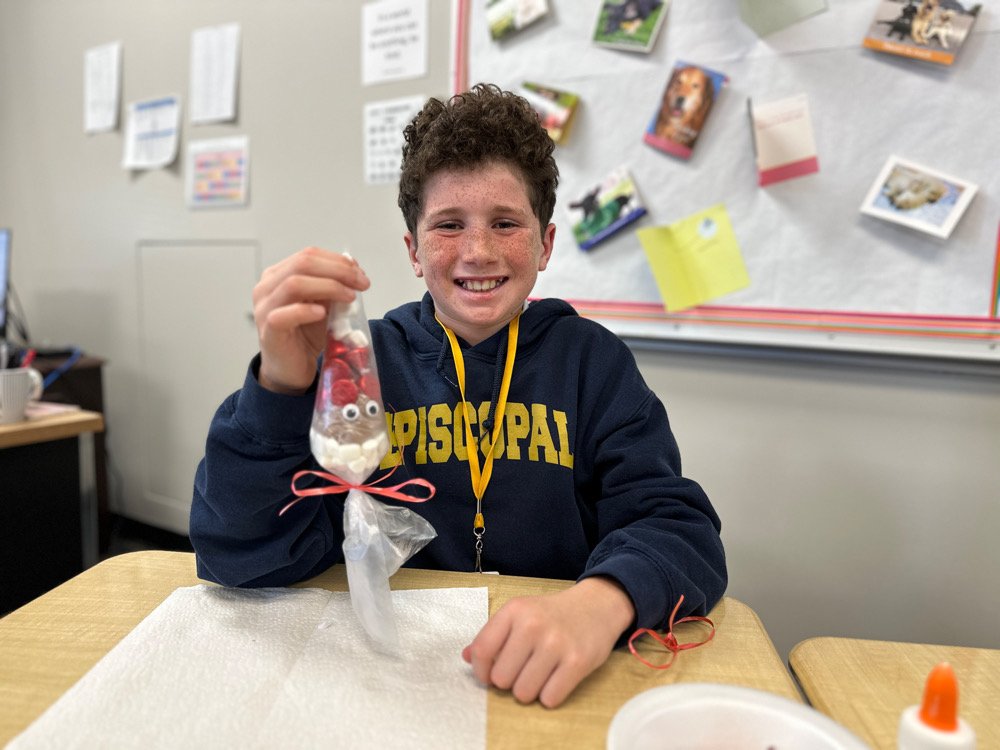 Middle School student with cocoa ornament