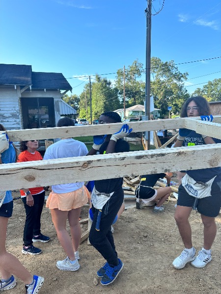 Students helping build a home